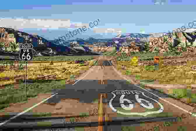 A Scenic View Of Route 66, With A Classic Car Driving Down The Highway Under A Blue Sky With White Clouds Moon Route 66 Road Trip (Travel Guide)