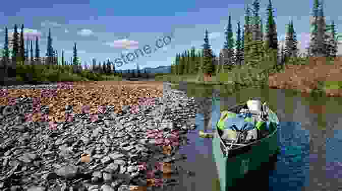 Canoeists Paddling Through The North Fork Of The Koyukuk River, Surrounded By Stunning Mountain Scenery A Canoe Trip On The North Fork Of The Koyukuk River: Gates Of The Arctic National Park Alaska