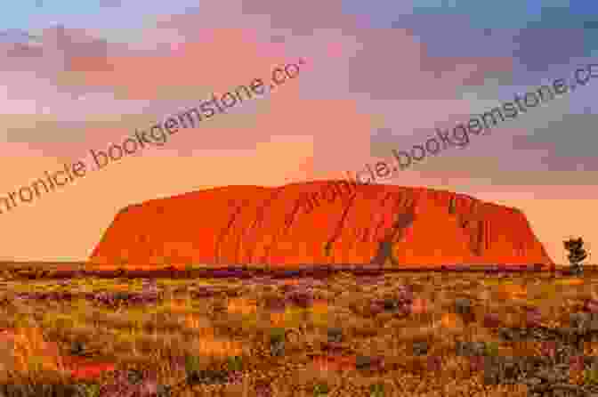 Uluru, Also Known As Ayers Rock, Is A Sacred Sandstone Monolith Located In The Red Centre Of Australia, Offering A Deeply Spiritual And Awe Inspiring Experience. Tales And Trails Down Under